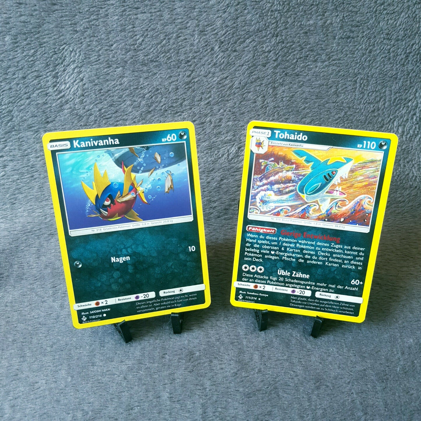 Pokemon - Kanivanha 110/214 & Tohaido 111/214 - S&M - Kräfte im Einklang 2019